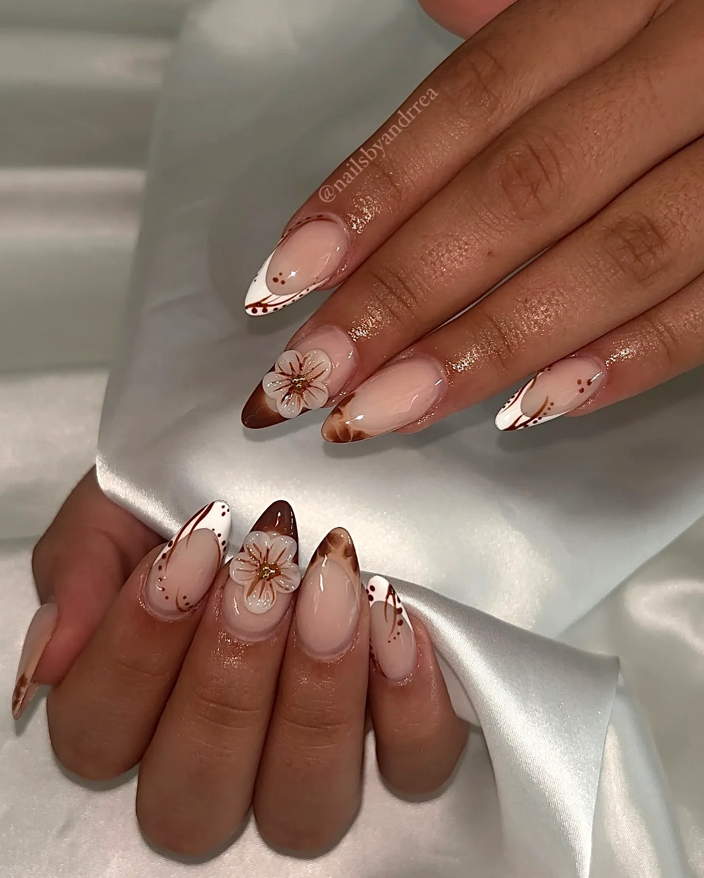 Elegant Almond-Shaped Brown Nails with Floral Accents and Glossy French Tip Style