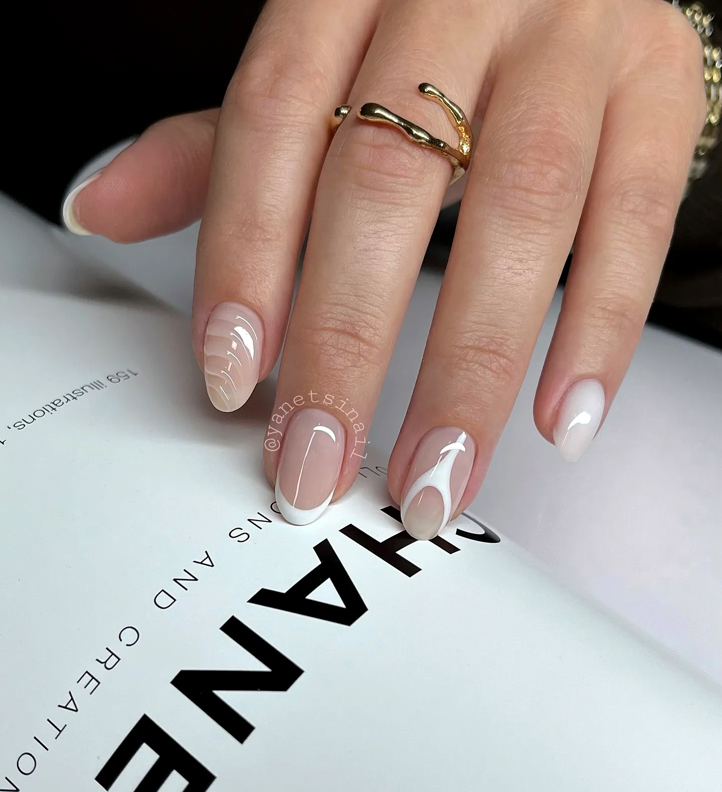 Elegant almond-shaped classy nail designs in white with minimalist art elements