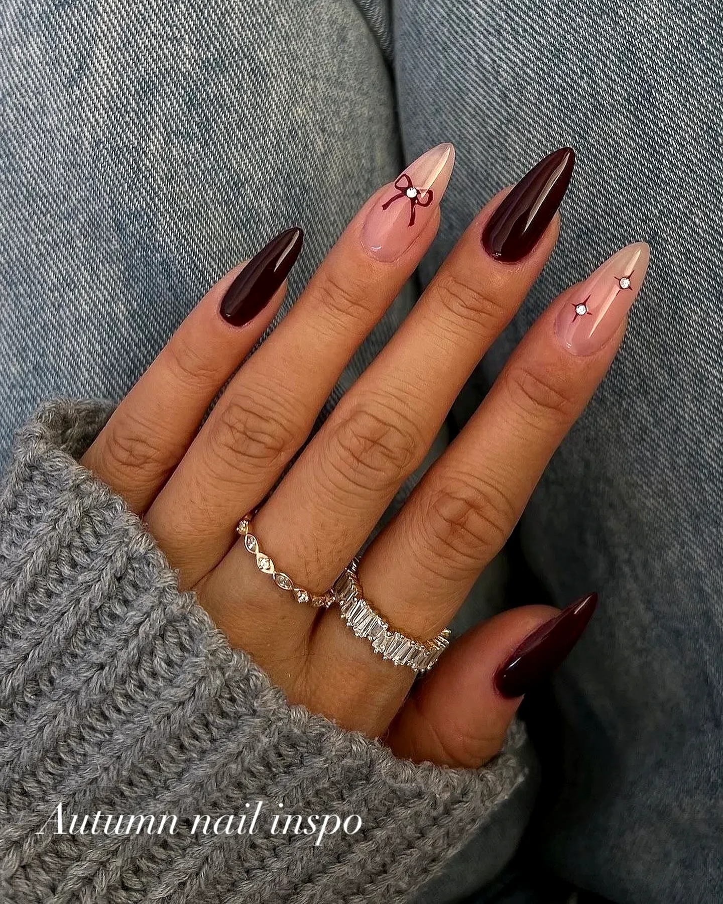 Elegant almond-shaped fall nail designs with dark burgundy and nude floral accents