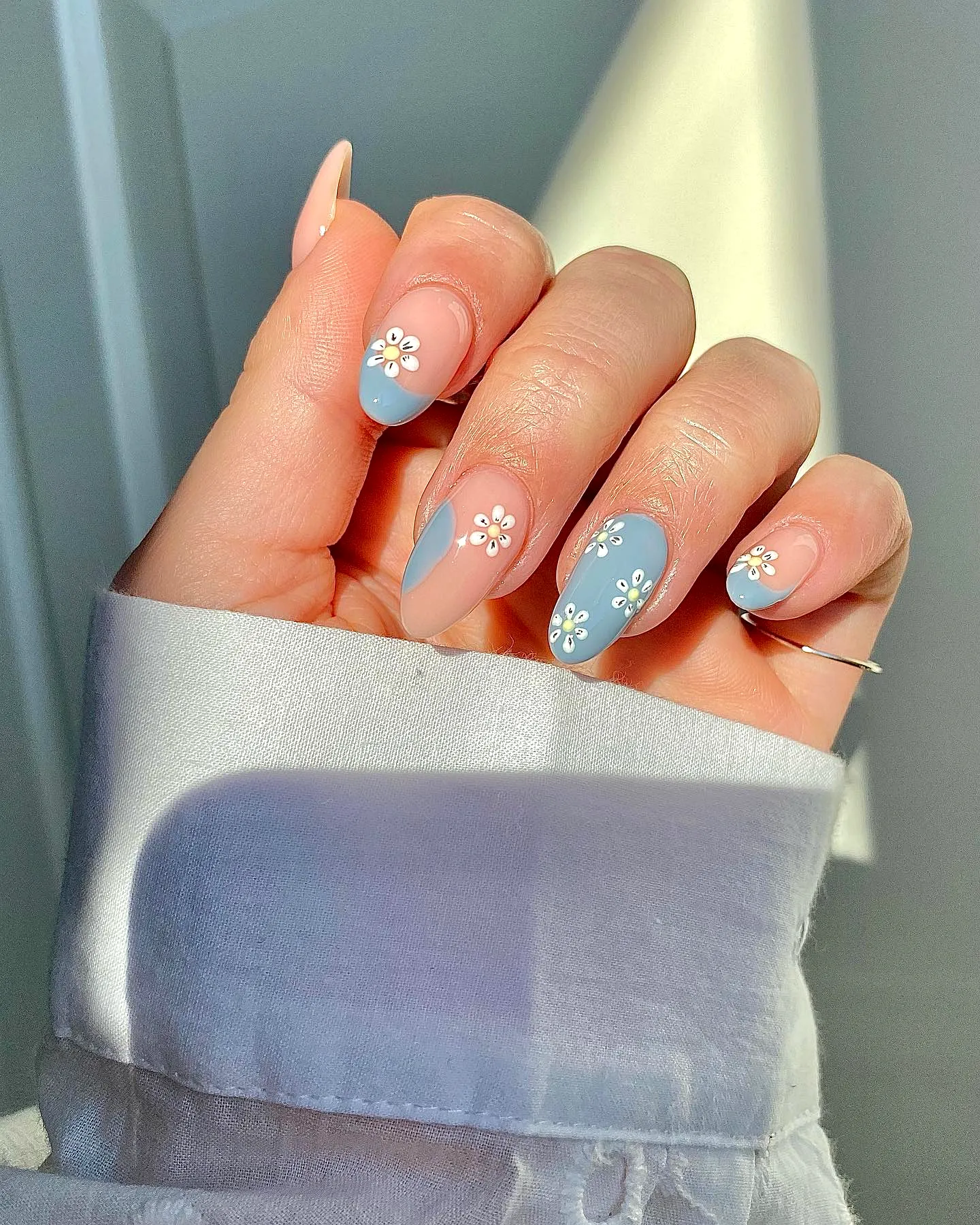Elegant almond shaped spring classy nails in pastel pink and blue with delicate floral art
