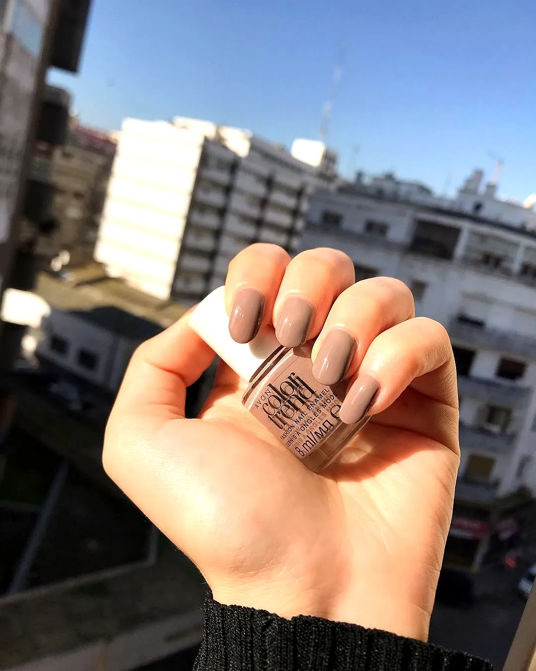 Elegant almond shaped taupe nails with a glossy finish