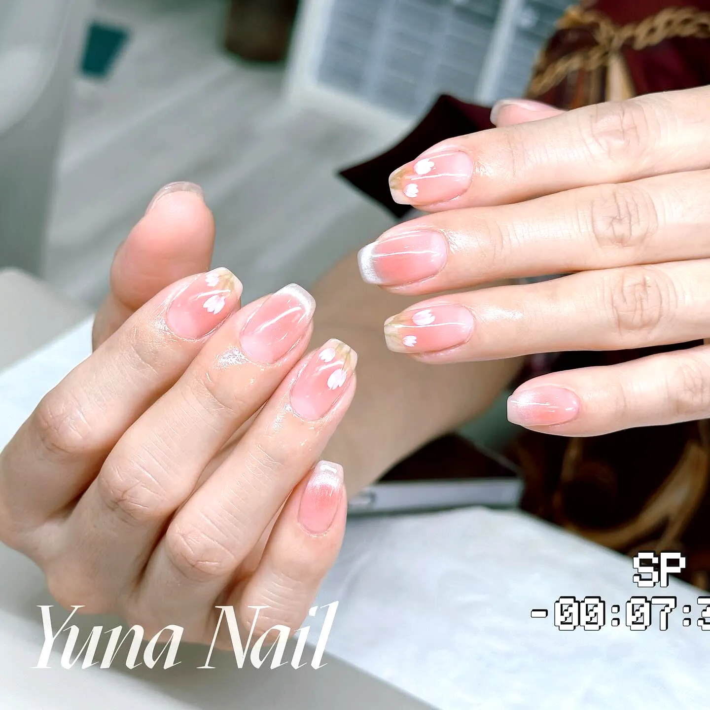 Elegant Almond Tulip Nail Designs with Soft Pink Base and Floral Tips