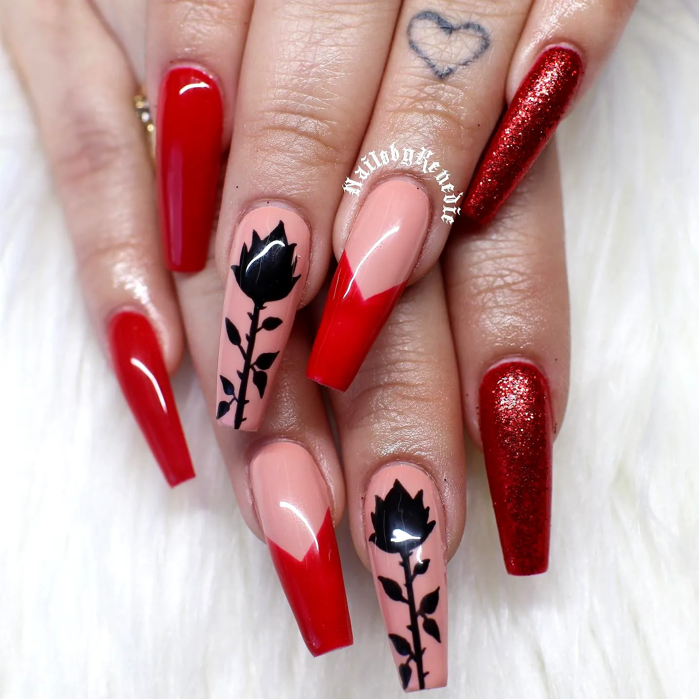 Elegant Long Coffin Silhouette Nail Designs in Red and Nude with Black Rose Accents and Glitter