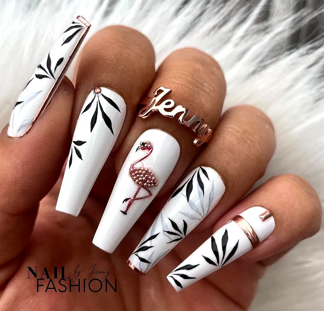 Elegant stiletto tropical nail designs with white and black leaf patterns and a flamingo