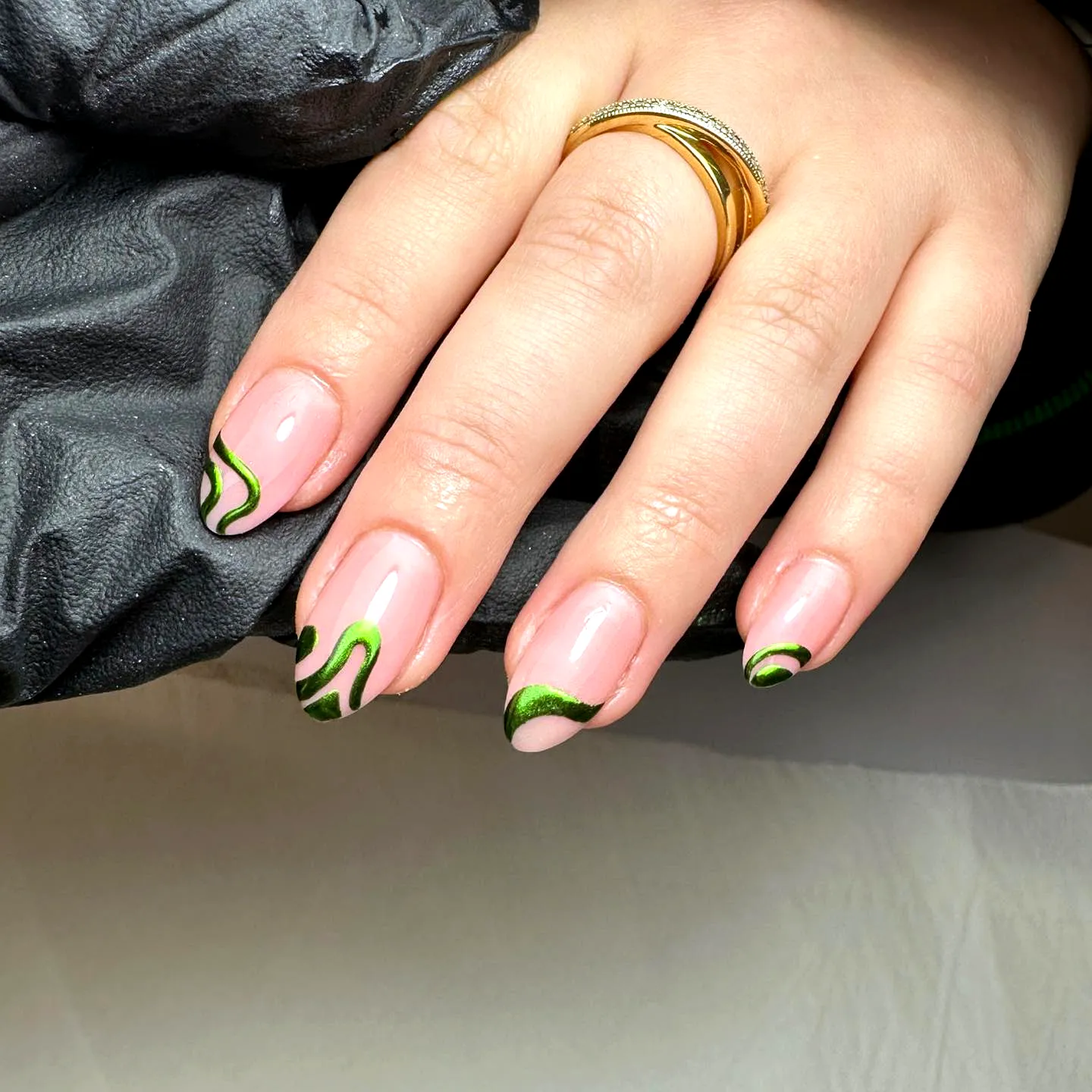 Elegant Swirl Nail Designs on Classic Shape with Nude Base and Vibrant Green Patterns