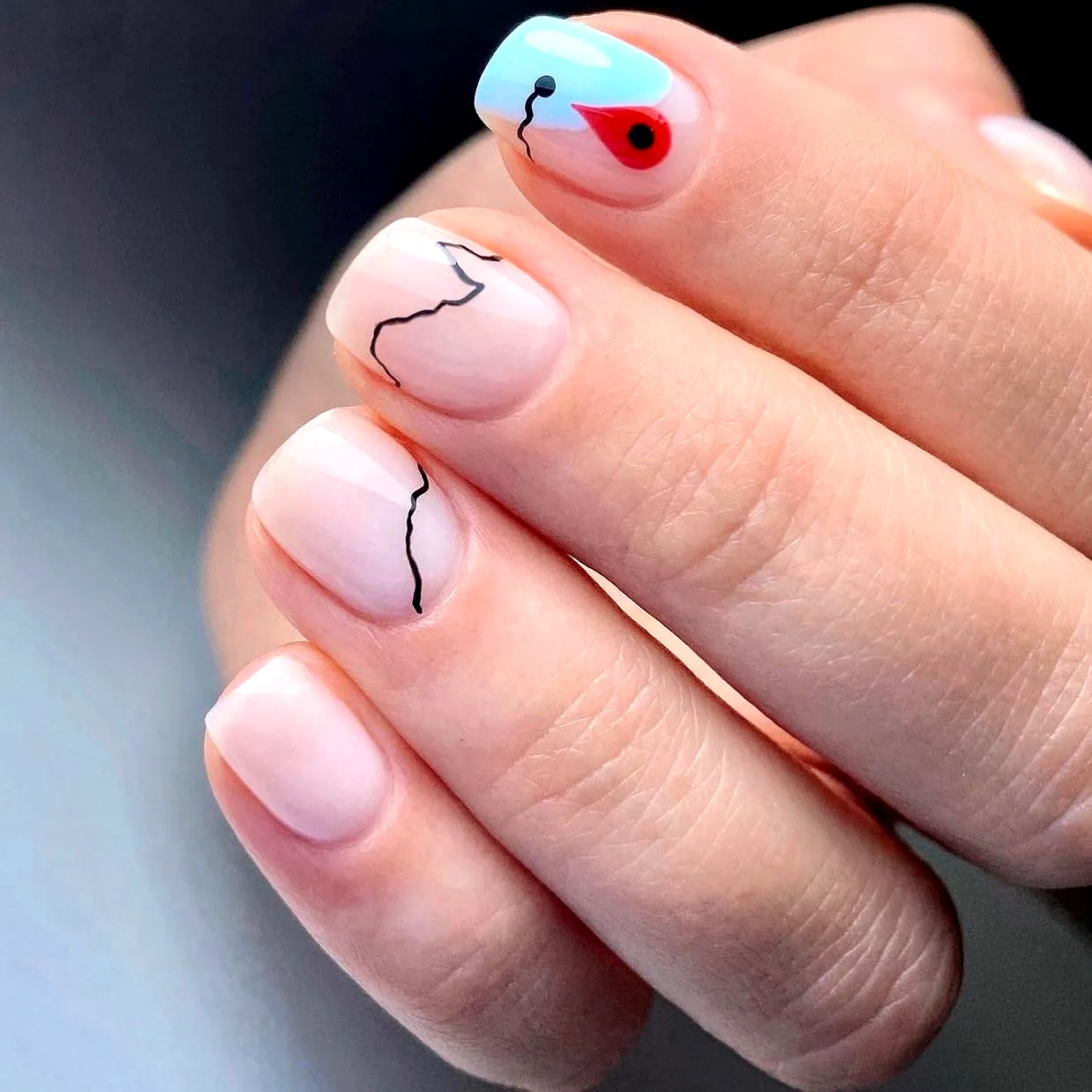 Elegant Travel-Inspired Nails with Square Shape Soft Nude and Light Blue Accents and Abstract Wave Design