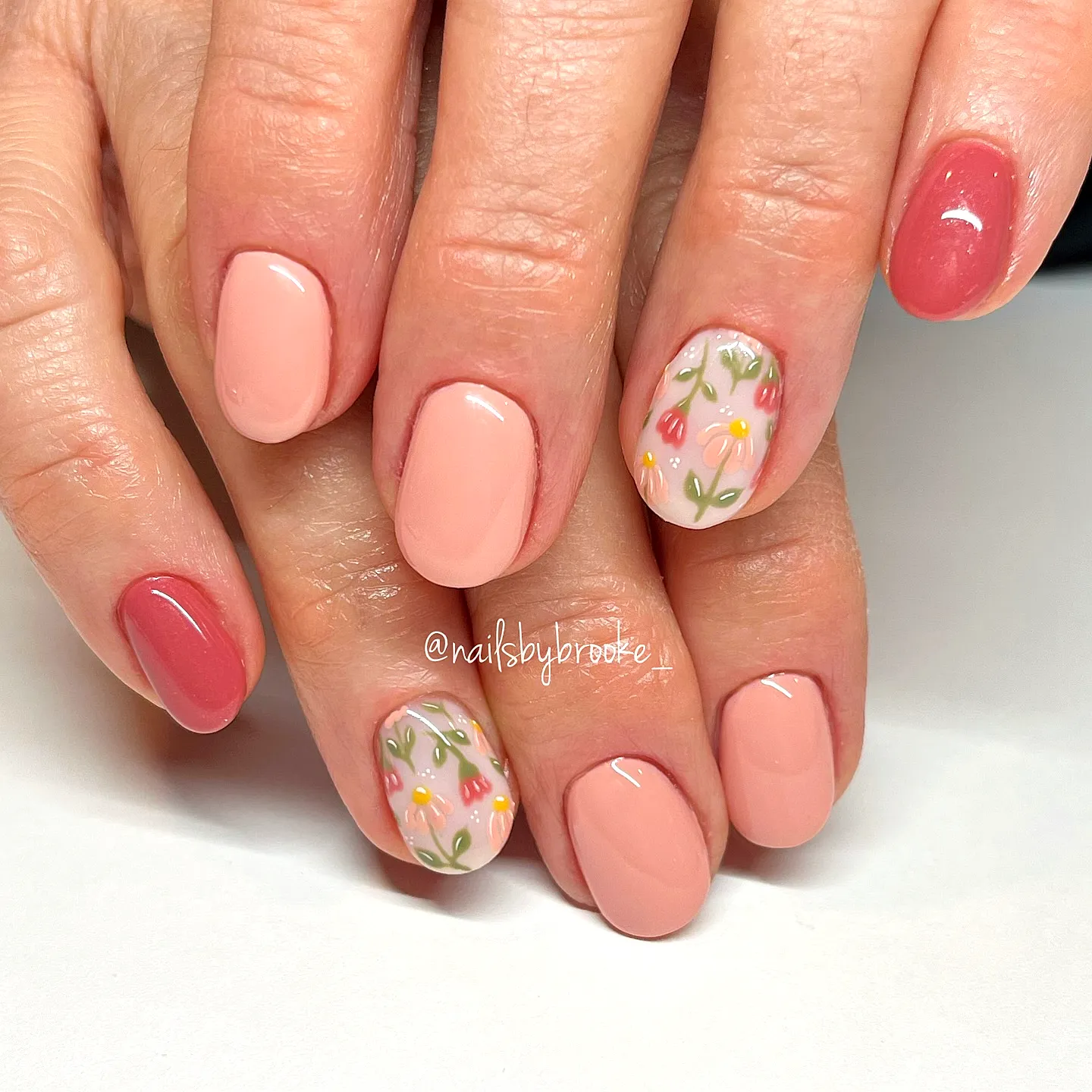 Elegant Tulip Nail Designs Featuring Oval Shape Soft Pink Base and Colorful Floral Accents