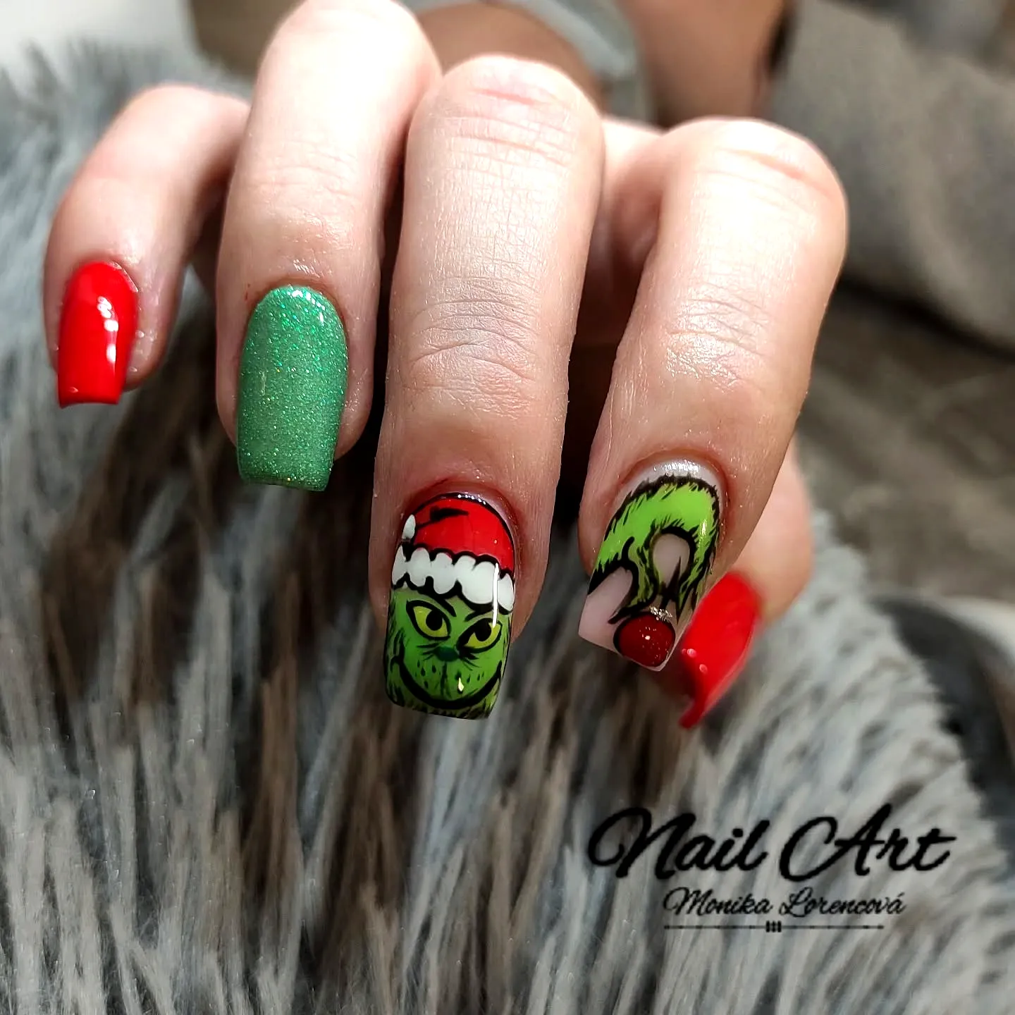 Festive Grinch Nails in Stylish Coffin Shape with Vibrant Red and Sparkling Green Christmas Art