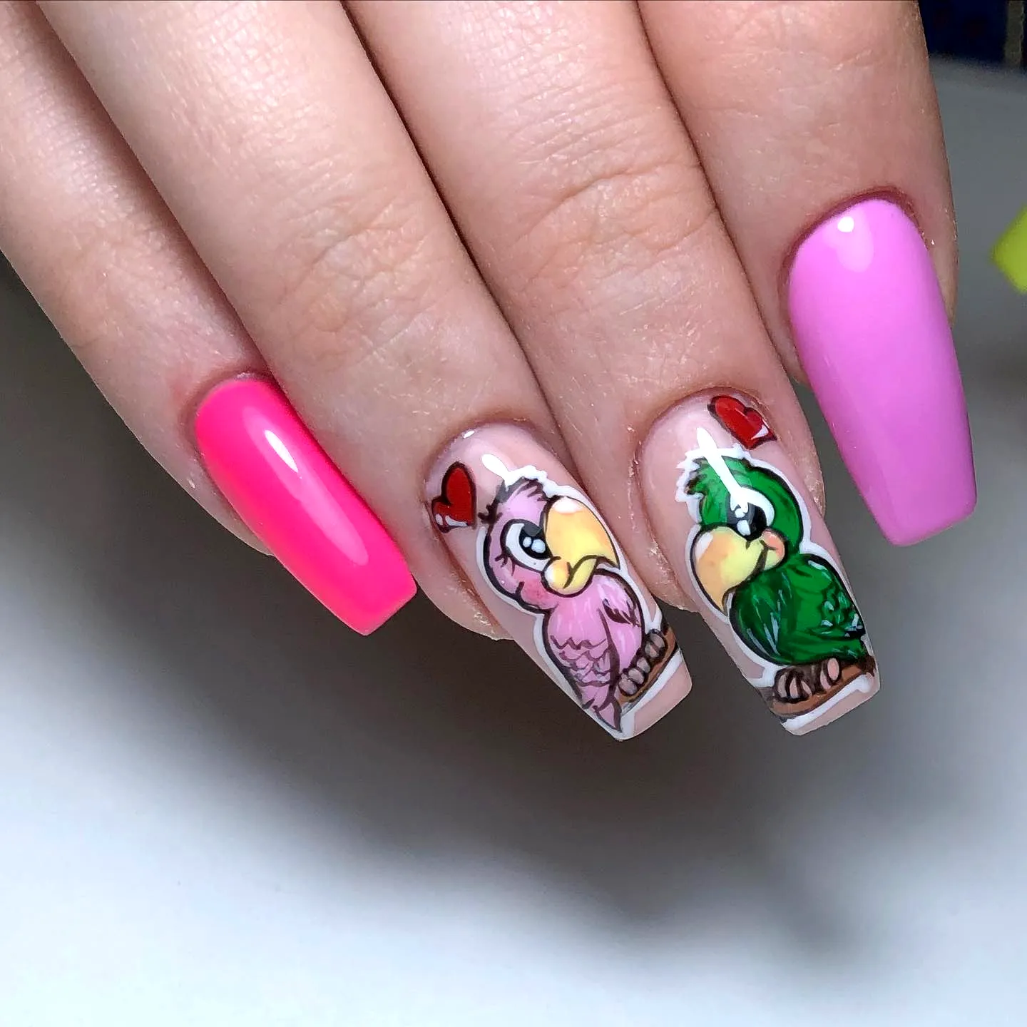 Playful Square Shaped Bird Nail Designs in Bright and Pastel Pink with Colorful Cartoon Birds