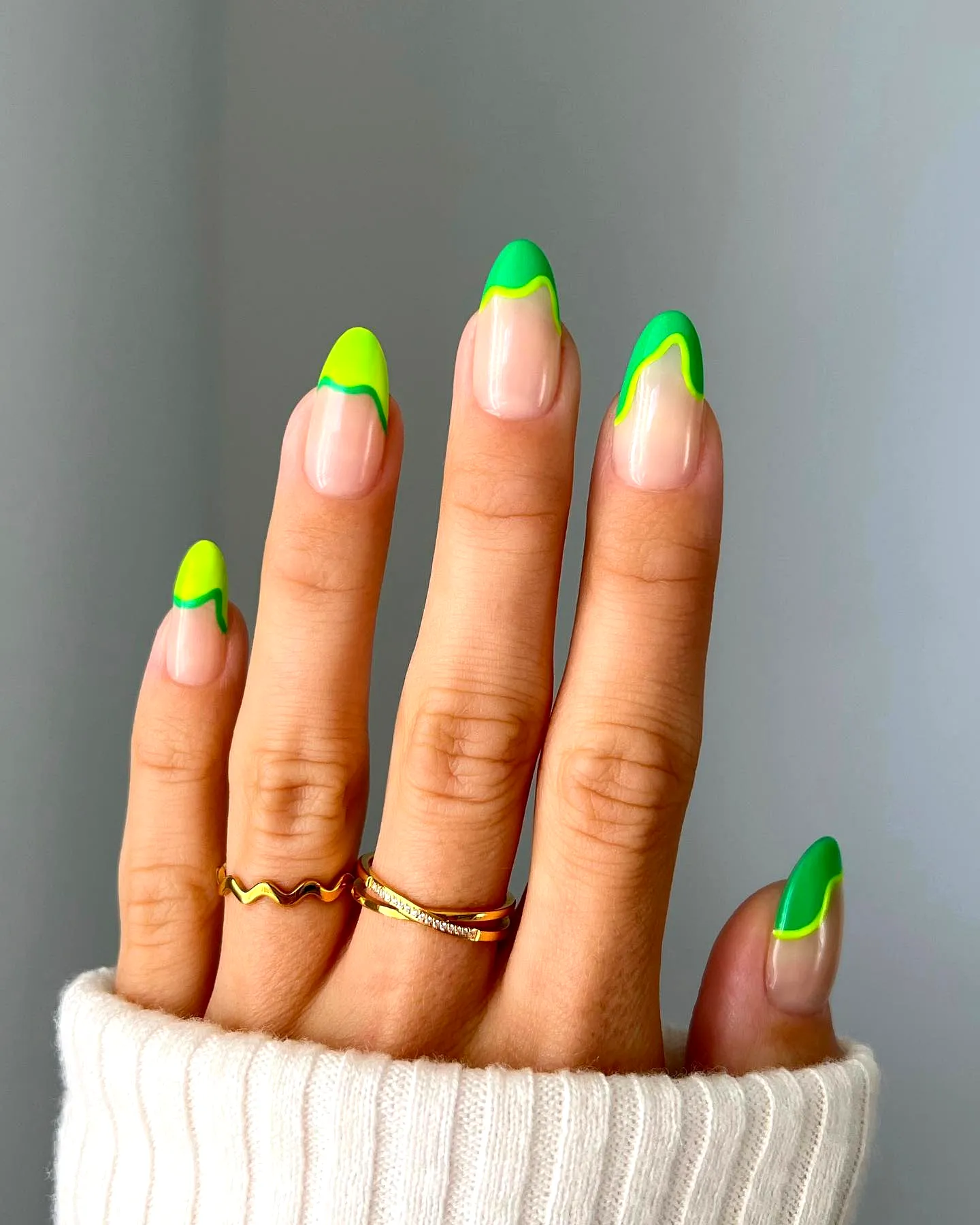 Playful Stiletto Neon Nails with Vibrant Green Tips and Dripping Effect