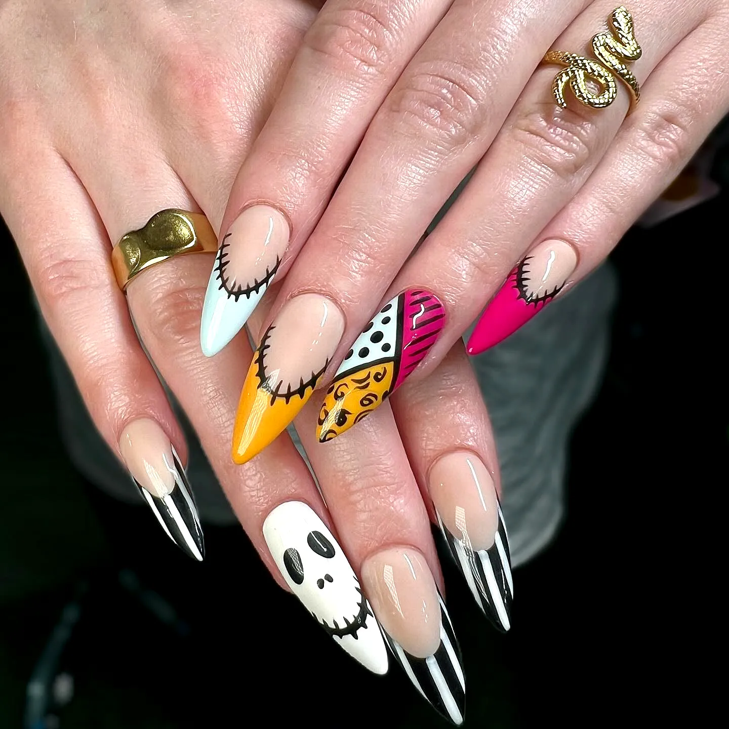 Playful Stiletto Nightmare Before Christmas Nails with Vibrant Colors and Whimsical Patterns