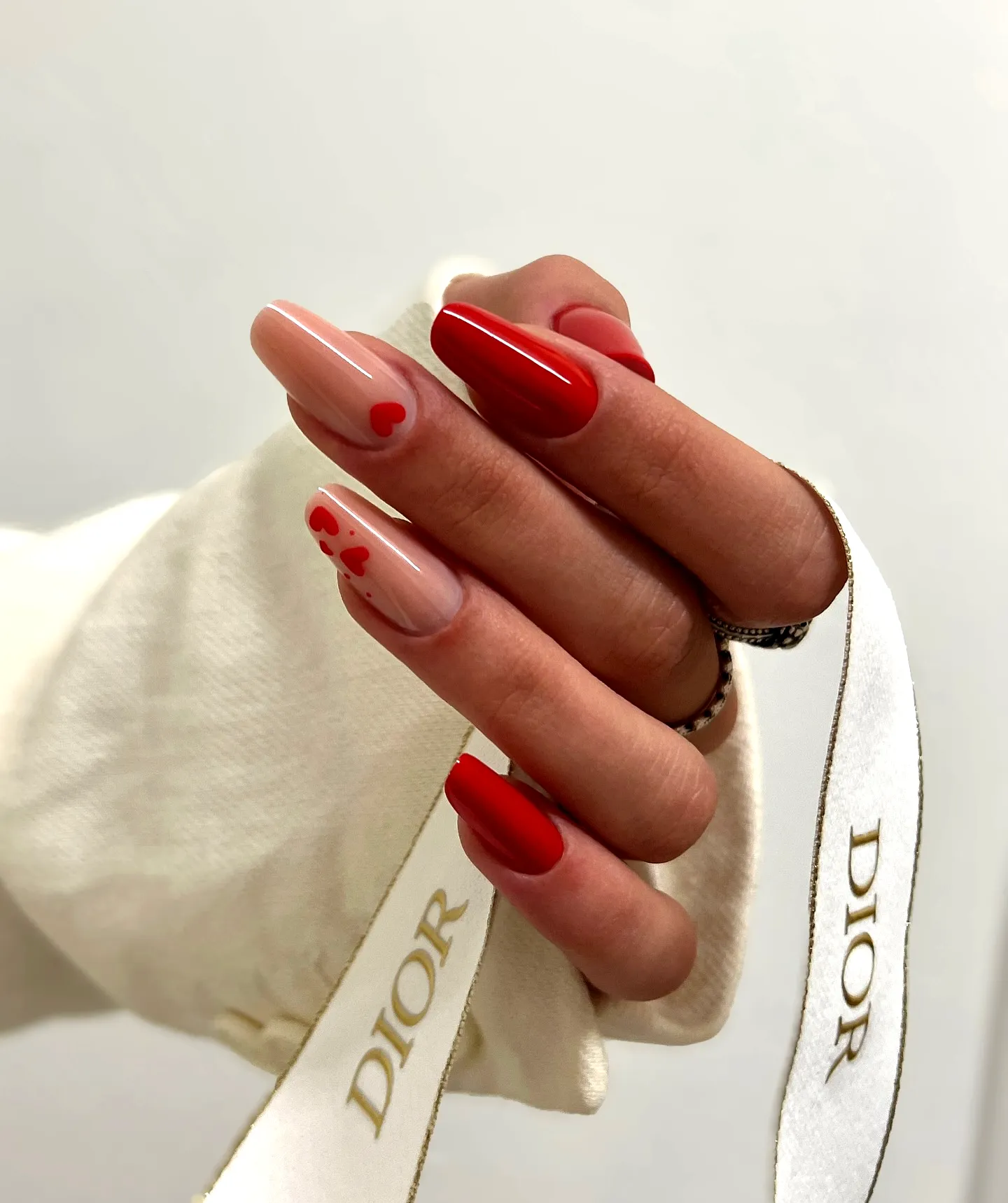 Romantic Valentines Day Nails with Almond Shape Red Color and Cute Heart Patterns