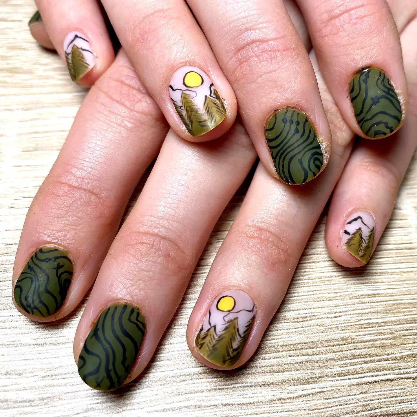 Serene Oval Matte Mountain Nails in Green and Beige with Nature-Inspired Patterns
