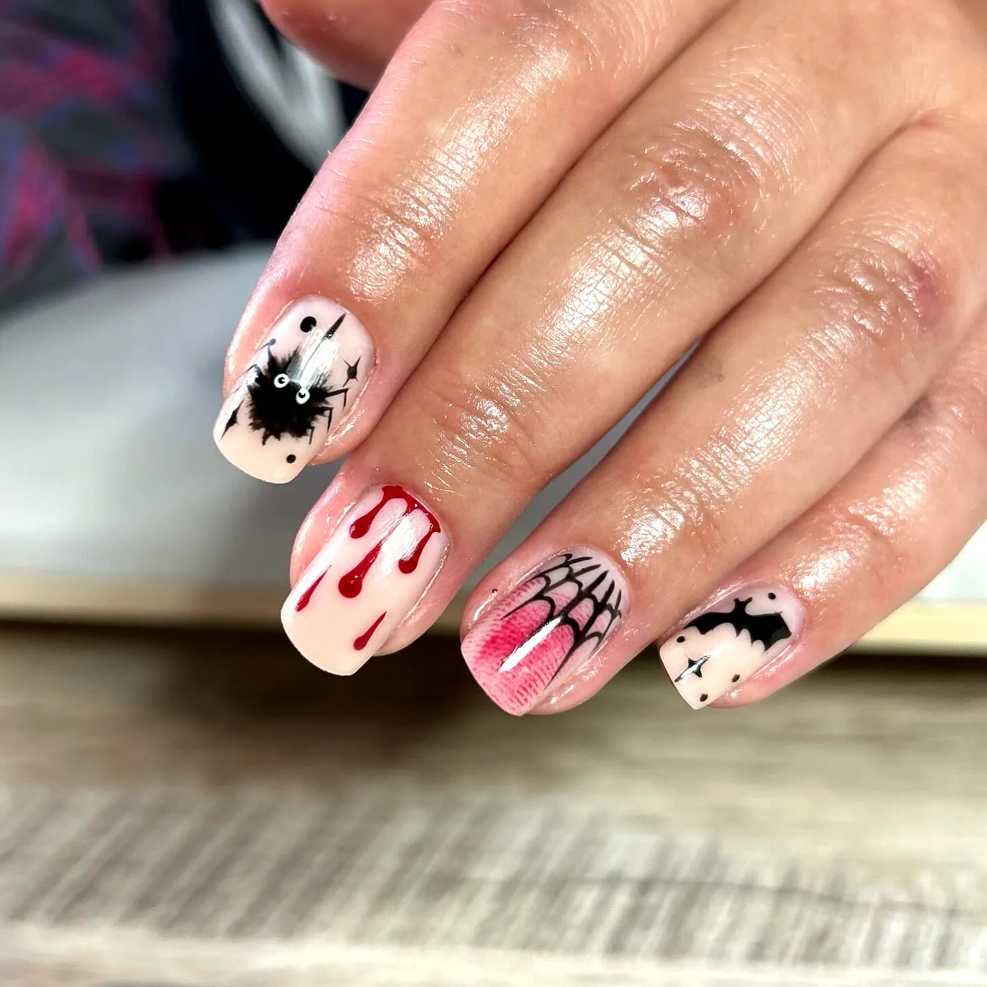 Spooktacular Square Halloween Nails with Red Dripping Effects and Charming Spider and Bat Illustrations