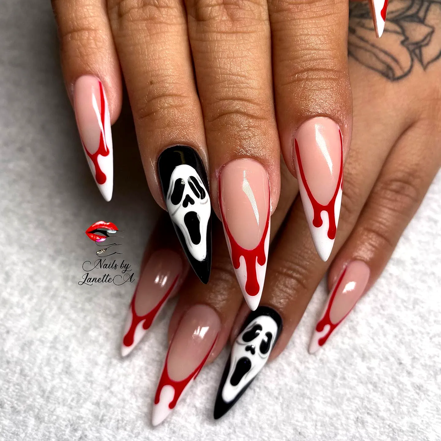 Spooky Stiletto Ghost Nail Designs with Glossy Finish and Dripping Red Effects