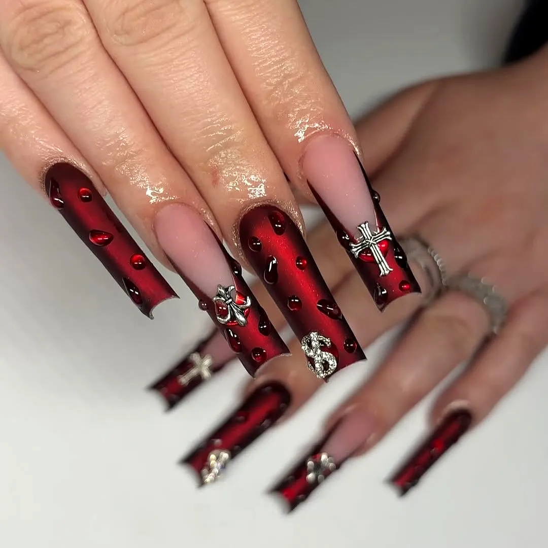 Stunning coffin-shaped red nails with 3D embellishments and matte finish