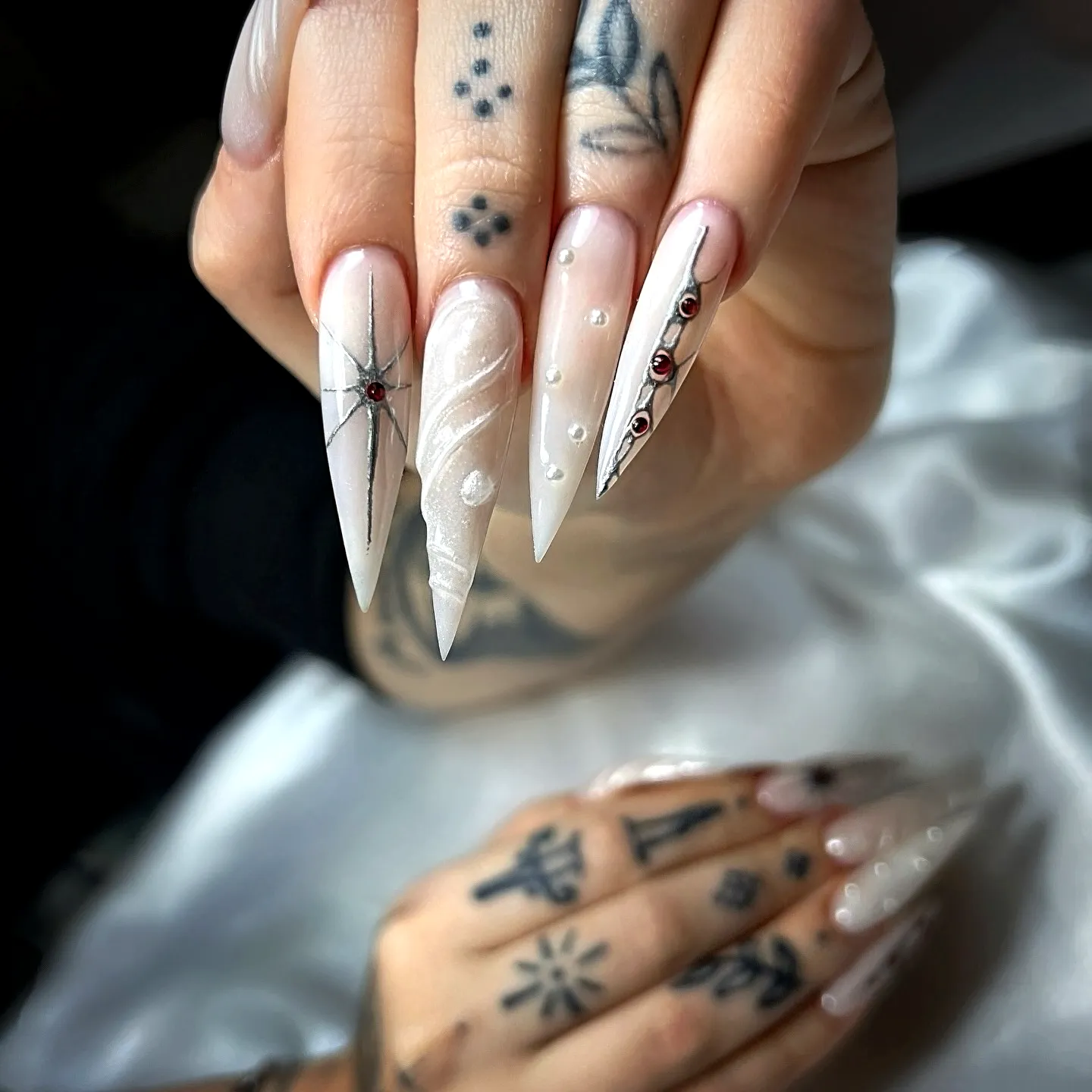 Stunning Off-White Stiletto Luxury Nails with Intricate Swirls Spider Web Design and Glamorous Gemstones
