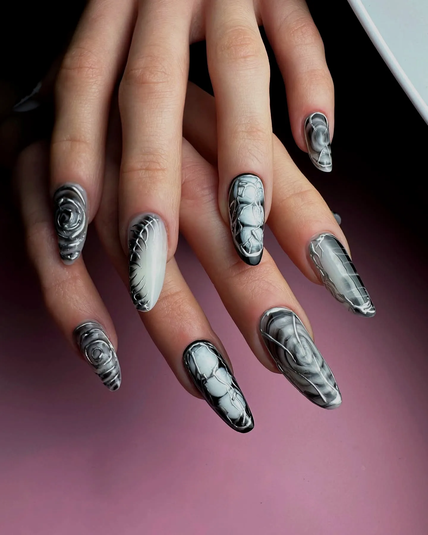 Stunning Tribal Nails with Elongated Shape Featuring Black White and Gray Marble and Intricate Rose Designs