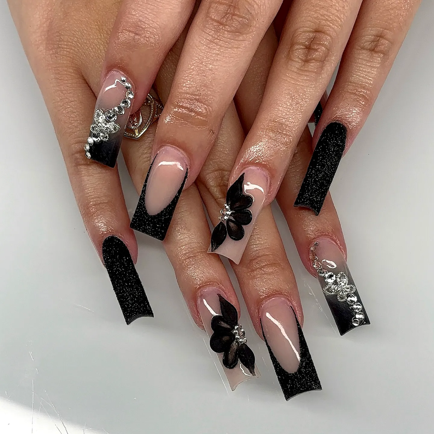 Stylish Coffin Shaped Black Birthday Nails with Floral Accents and Rhinestones