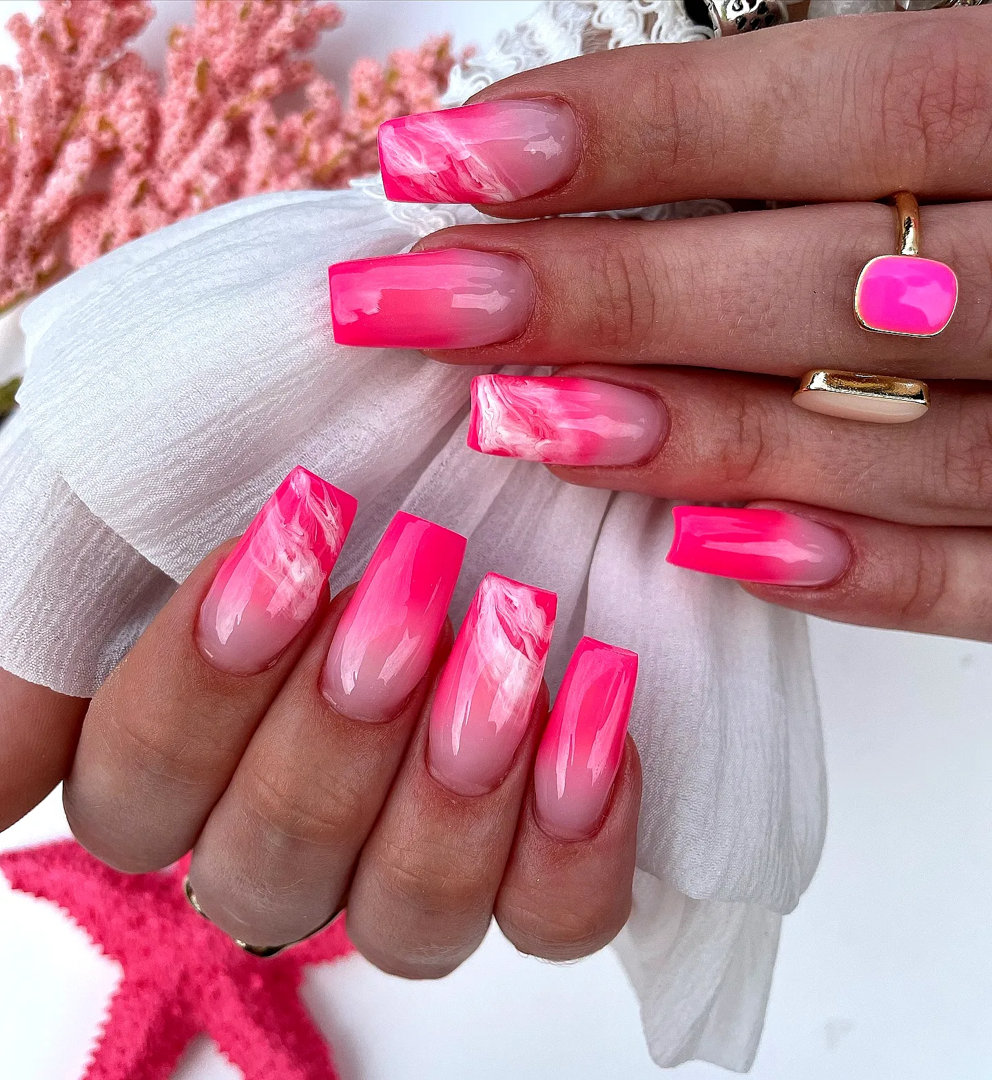 Stylish Long Square Neon Nails with Vibrant Pink Gradient and Marbled Art Elements