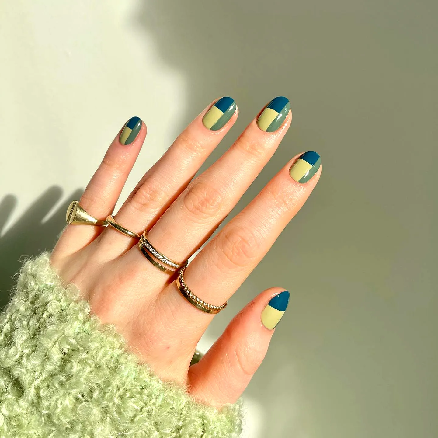 Stylish Oval Color Block Nails with Muted Yellow and Deep Teal Geometric Patterns