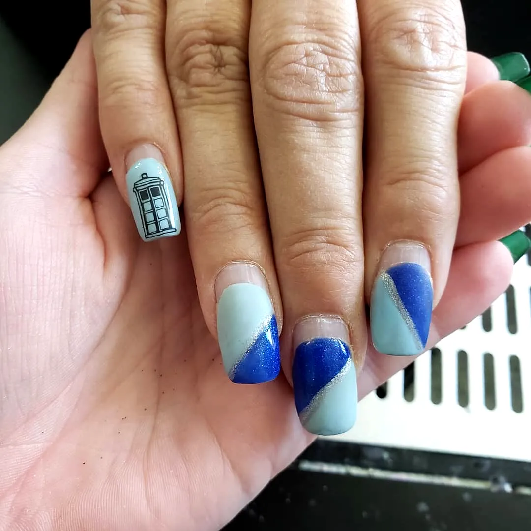 Stylish Square Travel-Inspired Nails with Blue Shades and Gold Accents