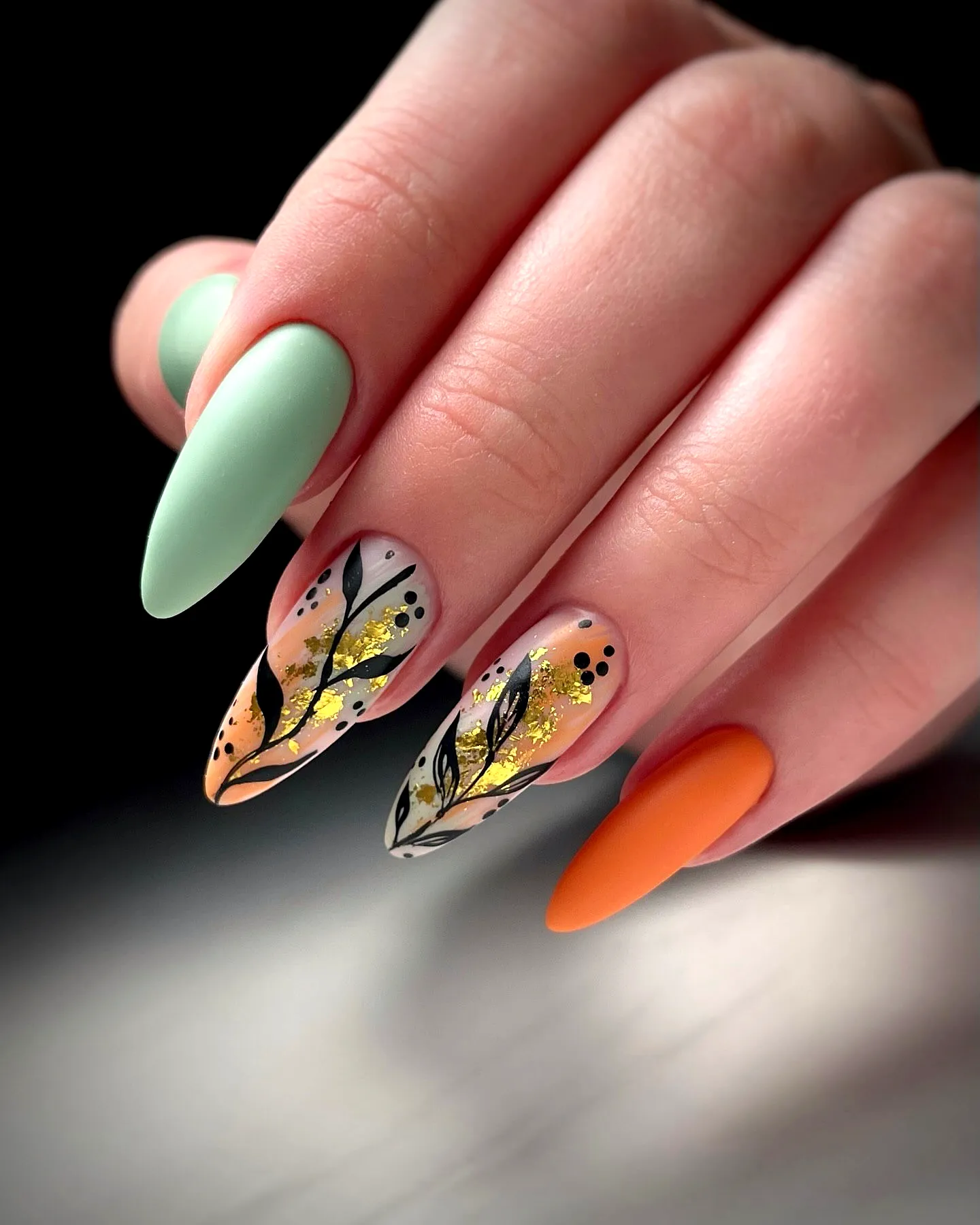 Trendy Pointed Almond Fall Nail Designs with Mint Green Orange Gradient and Floral Patterns