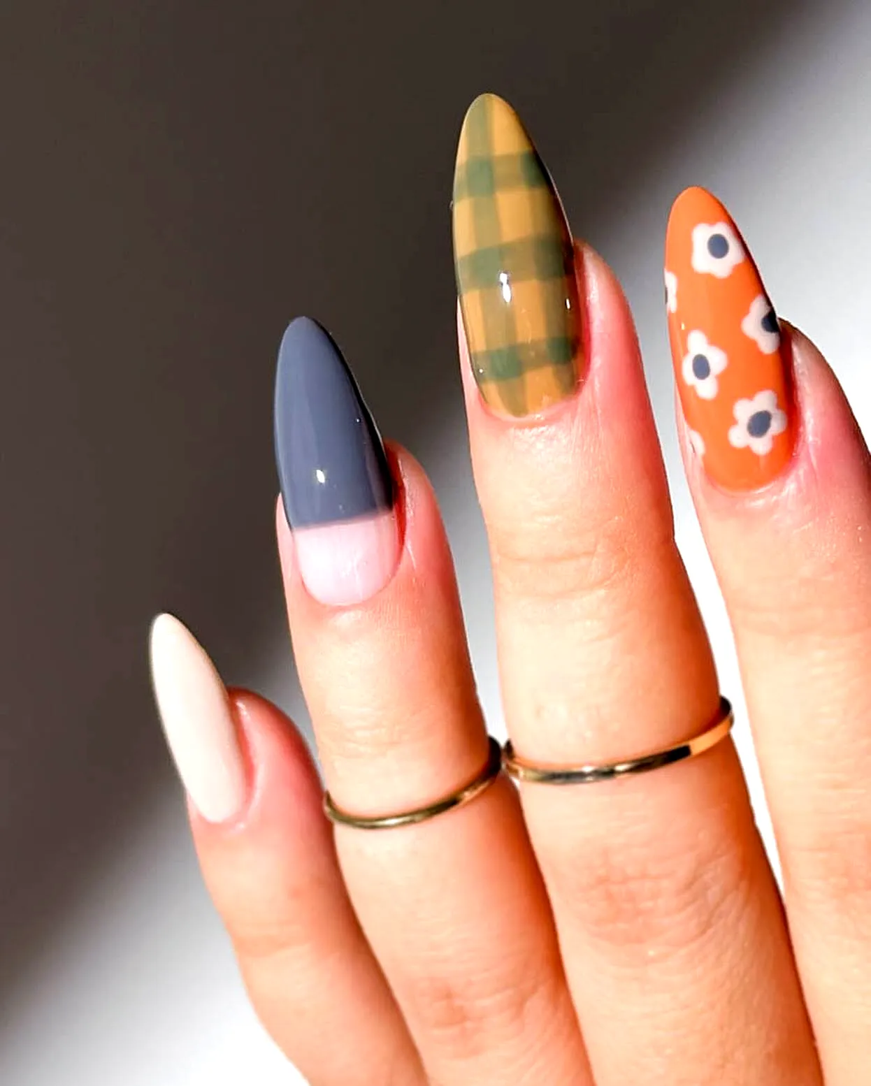 Trendy Stiletto Fall Nail Designs with Earthy Tones Floral and Plaid Patterns