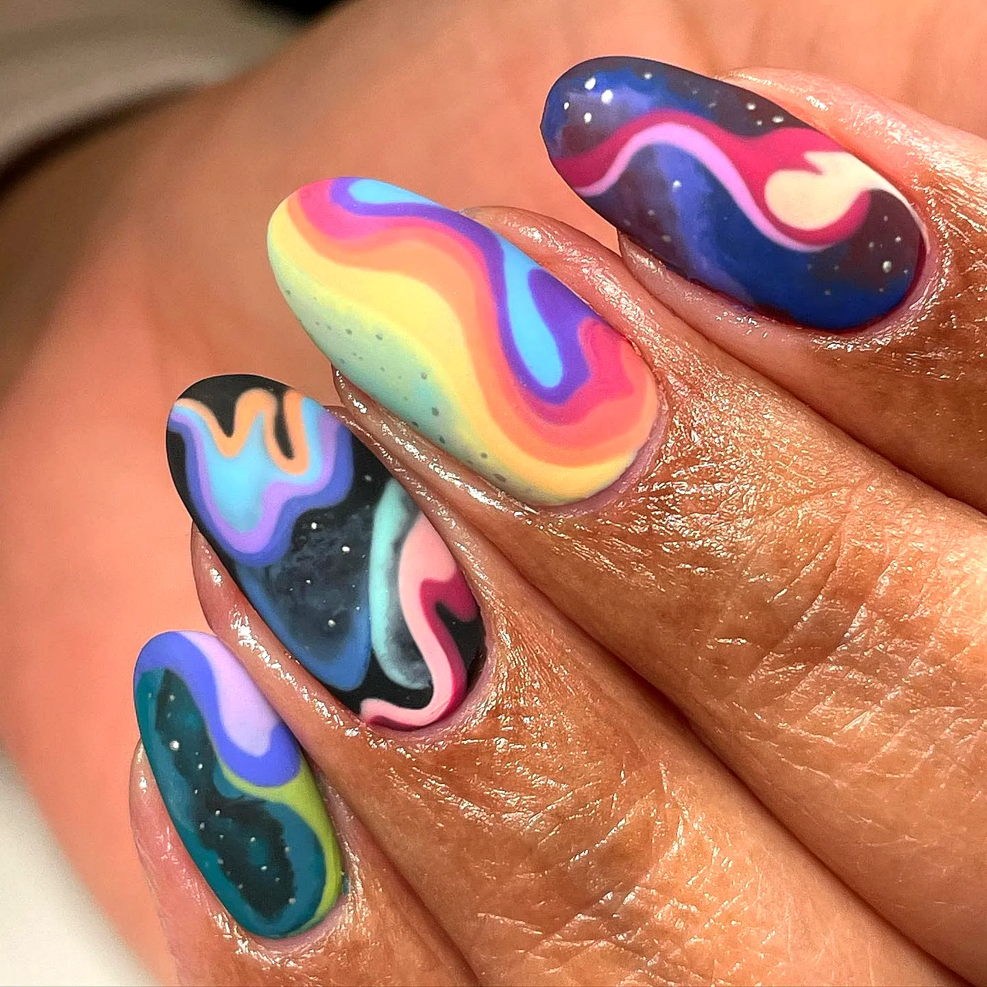 Vibrant Almond Color Block Nails with Playful Swirl Pattern and Glossy Finish