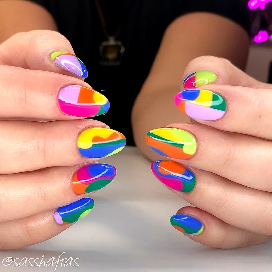 Vibrant Oval Color Block Nails with Playful Abstract Patterns