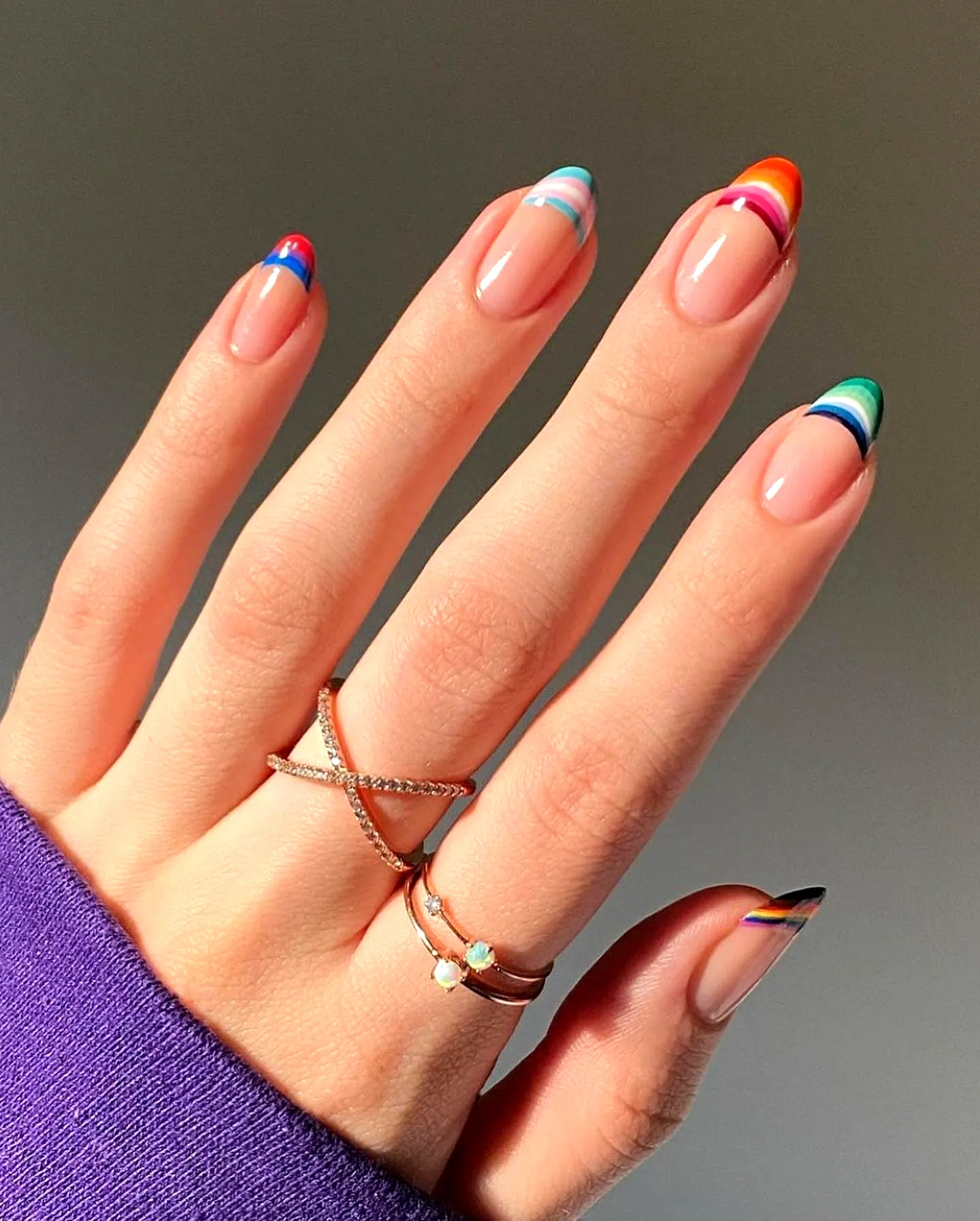 Vibrant Playful Rainbow Nail Designs on Sharp Oval Tips with Glossy Finish