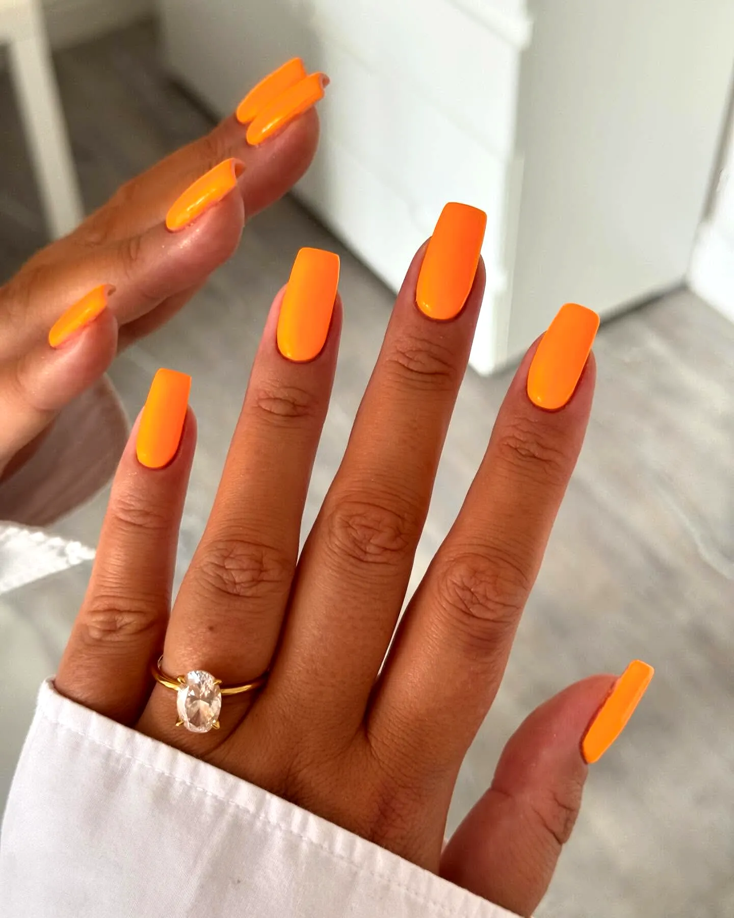 Vibrant Square Orange Nails with a High-Shine Finish for a Bold Statement