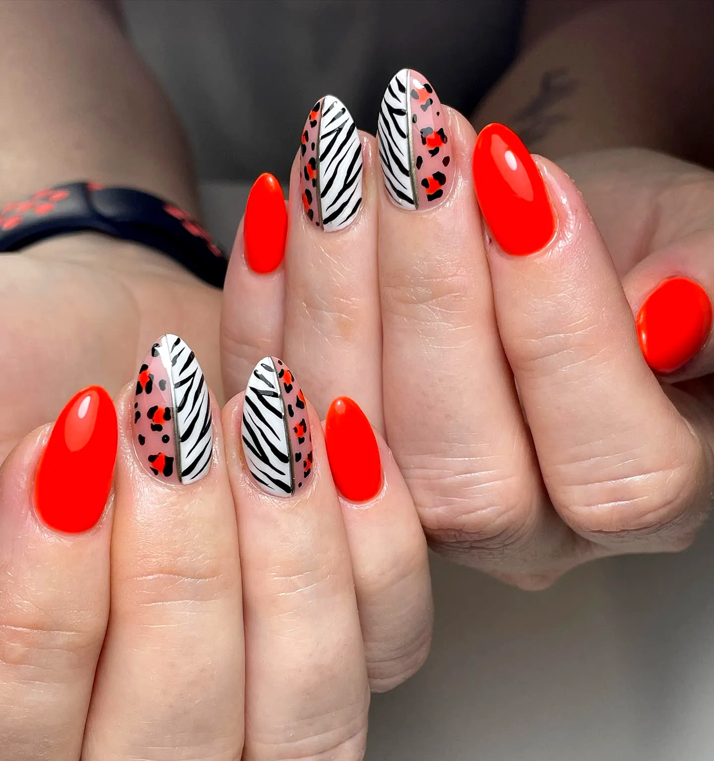 Vibrant Stiletto Animal Print Nails with Bold Zebra Stripes and Playful Spots