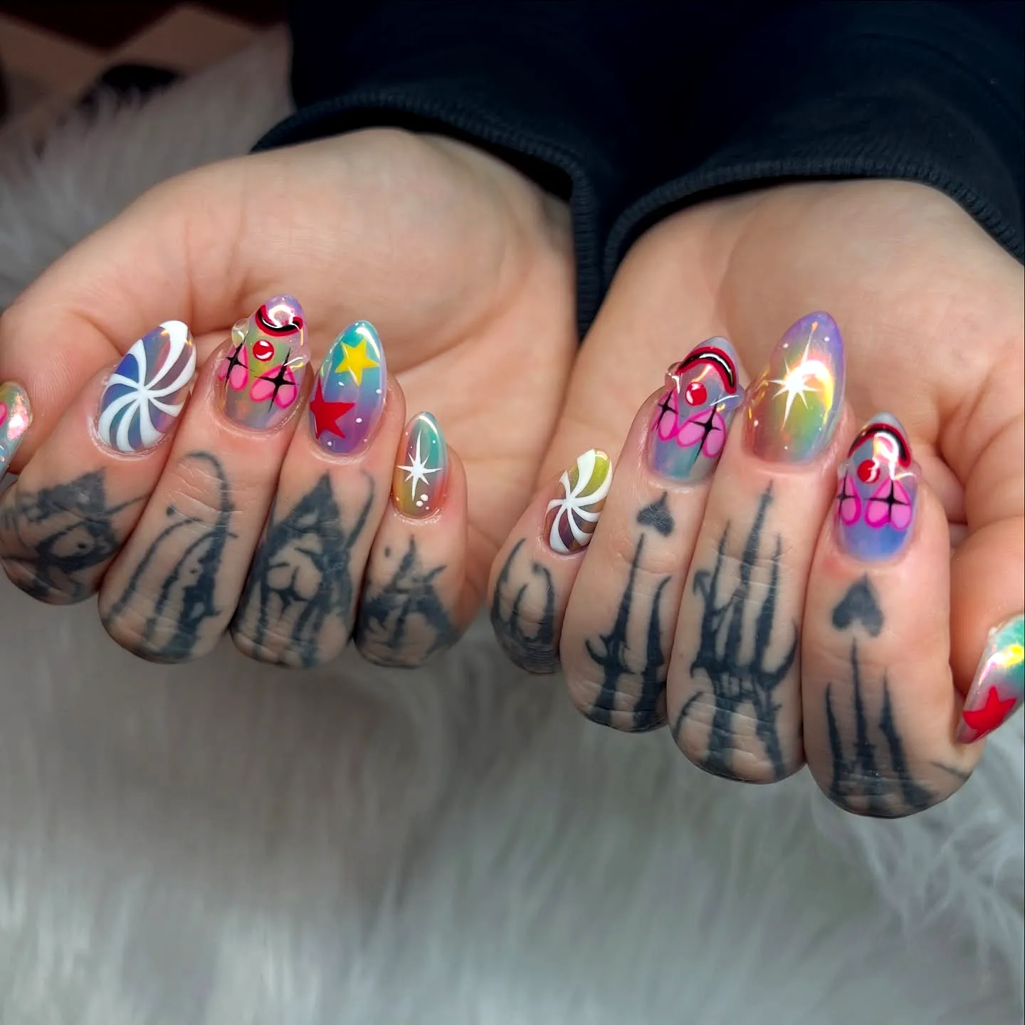 Vibrant Stiletto Clown Nail Designs with Playful Swirls Stars and Glossy Matte Finishes