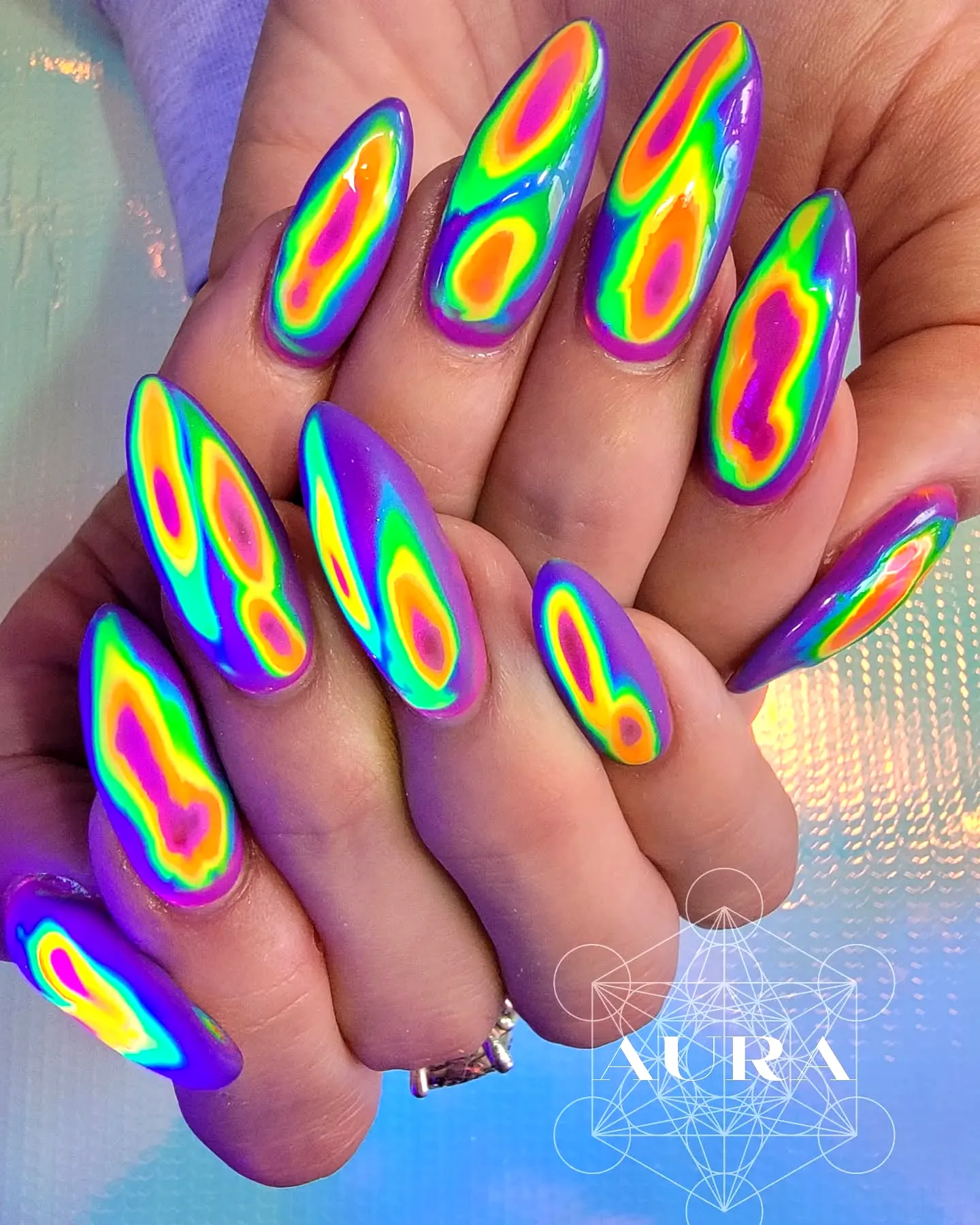 Vibrant Stiletto Rainbow Nail Designs with Iridescent Gradient and Glossy Finish