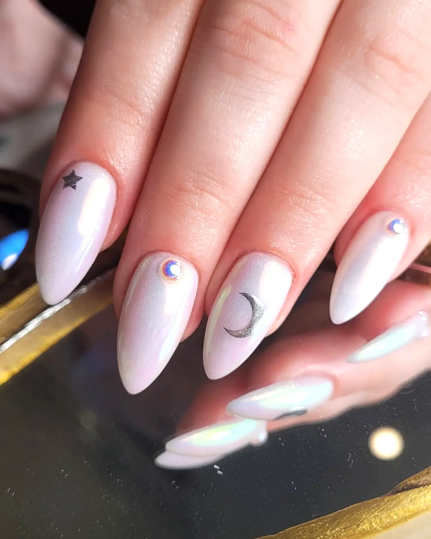 Whimsical Almond Shaped Honeymoon Nails in Pearlescent White with Celestial Art Elements
